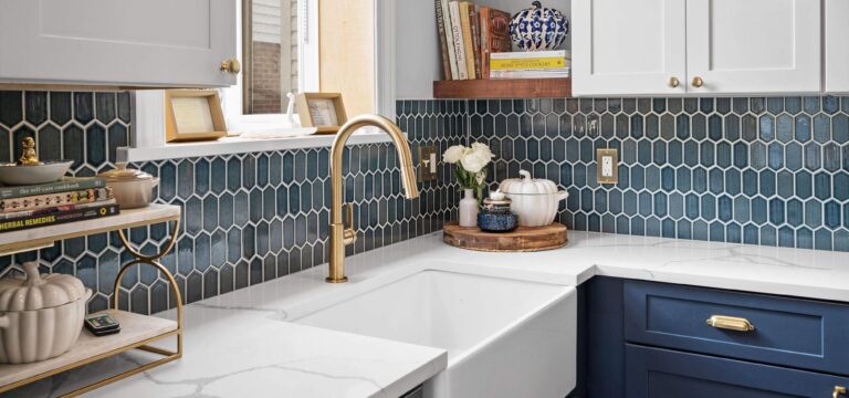 Blue tile kitchen with a white farmhouse sink